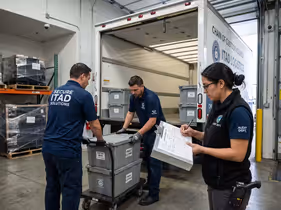 Image showing professional handlers securely transporting IT assets